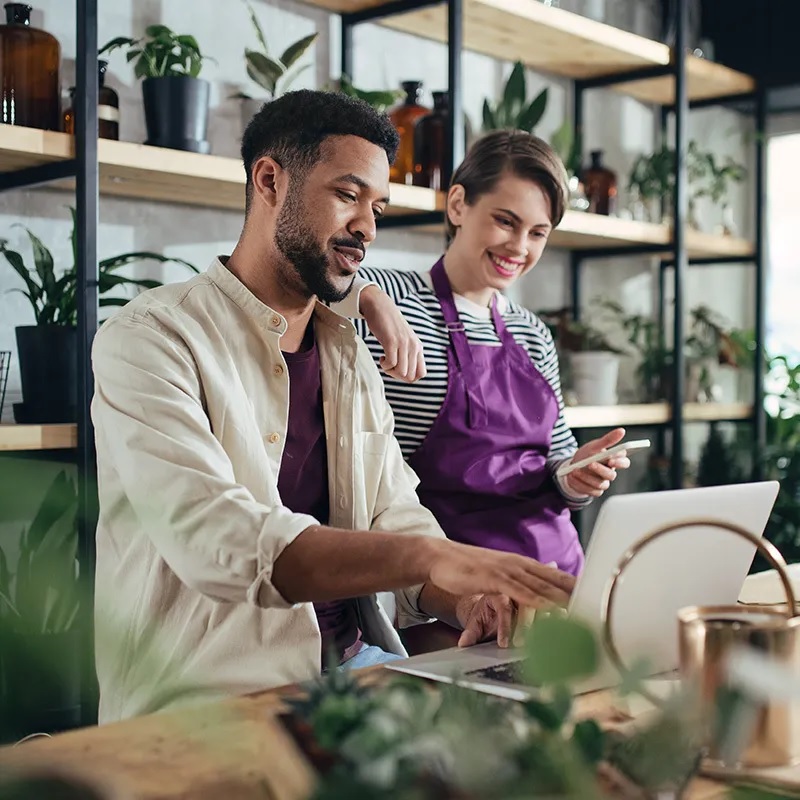 Small business owner reviewing finances in her shop