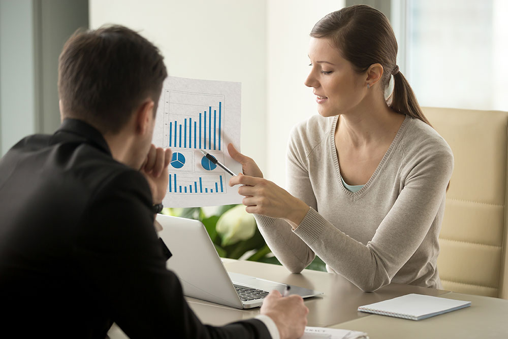 Small business owner reviewing finances in her shop